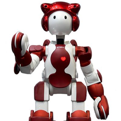 A friendly looking red and white humanoid robot with a cartoonish appearance. It has a glowing red heart shape on it's chest.