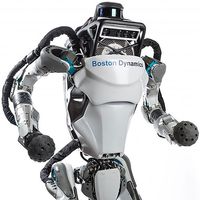 An advanced looking two legged robot stands in a dynamic pose.