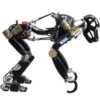 A robot with two legs and hooked arms bends over to be in quadruped form.