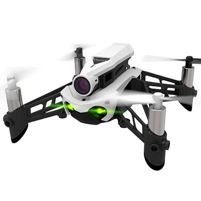 A white drone with glowing green lights for eyes in flight, with a white background.