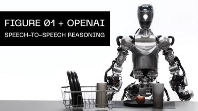 The Figure robot stands in front of an apple and dish rack talking to a human.