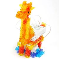 Brightly colored yellow and orange blocks, along with a white brick and blue base form the shape of a giraffe.