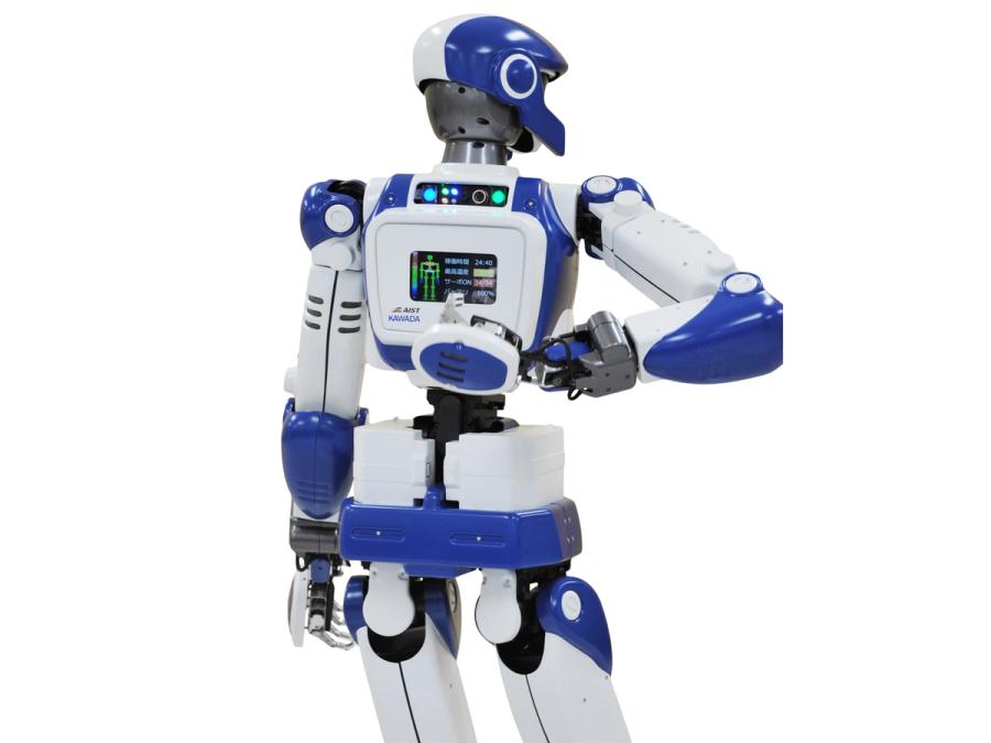 A rear view shows the robots backpack with a display screen, which it is reaching a hand back to touch.
