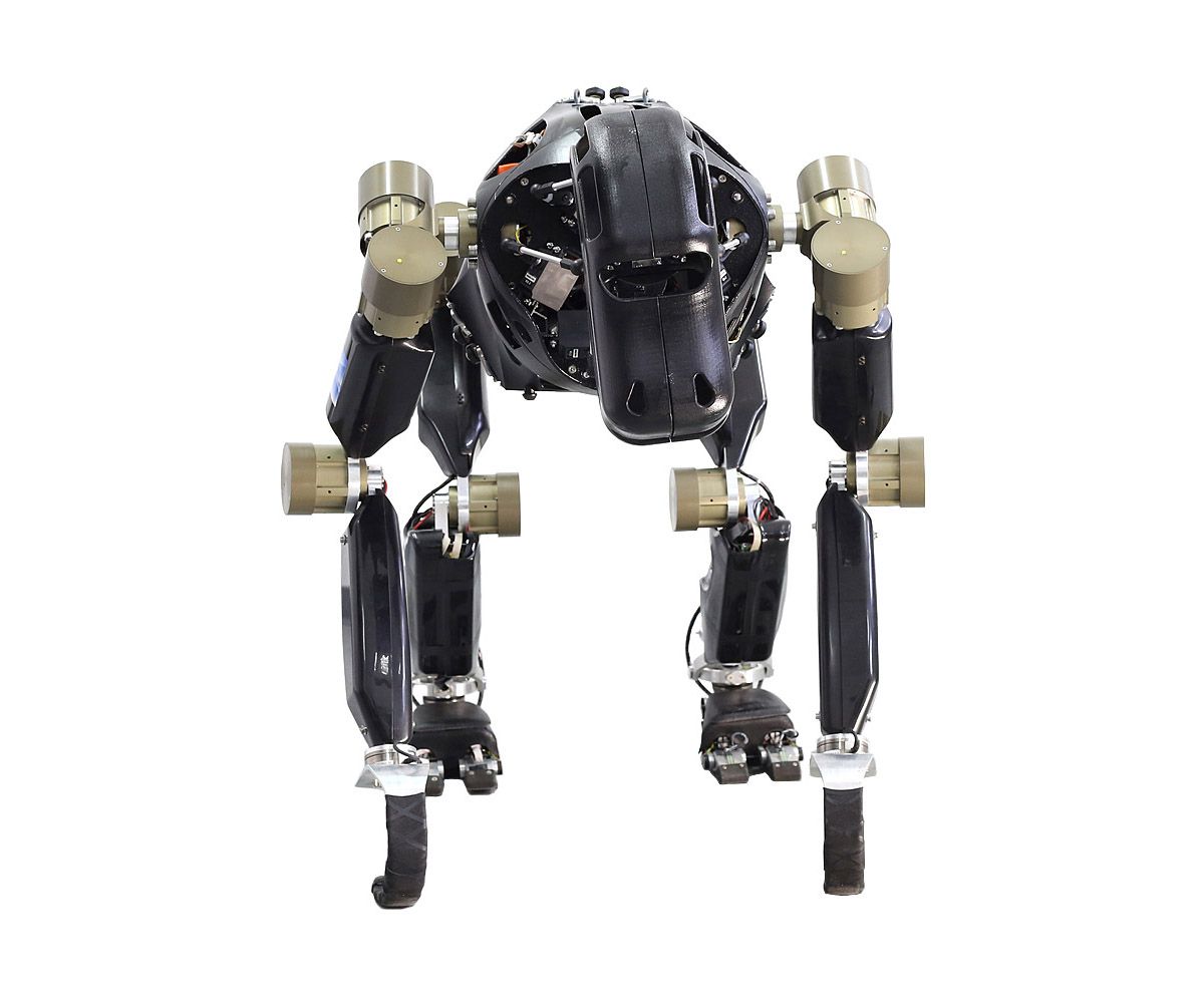 A series of images show a spin of a robot with two legs and hooked arms bent over to be in quadruped form.