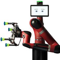 A red industrial one armed robot with an end effector consisting of of four suction cups extending out from a single unit. The robot has a tablet display head showing expressive eyes and eyebrows.