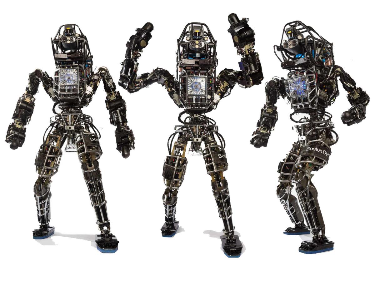 Three views of the 2013 Atlas robot show a complex electronics and sensor laden humanoid robot.