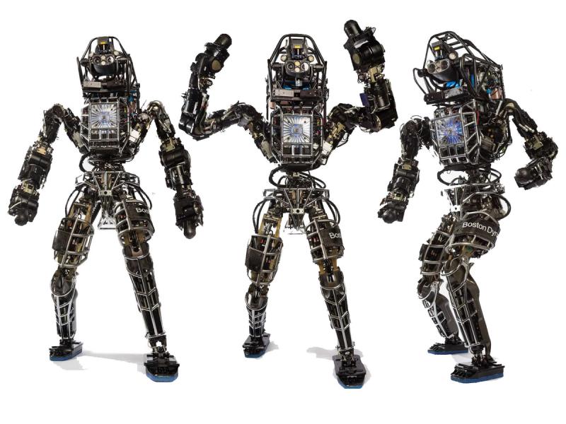 Three views of a complex electronics and sensor laden humanoid robot.