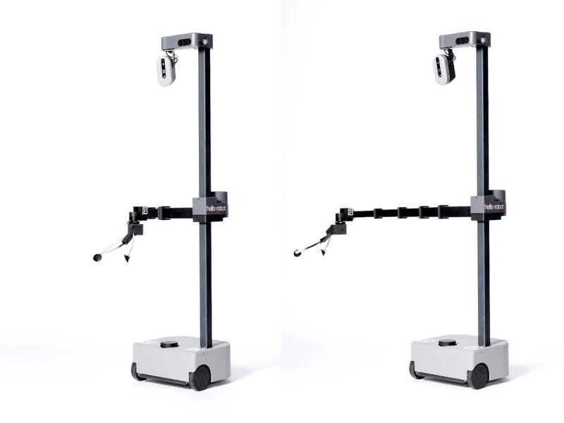 Two  mobile robots with a white base supporting a tall black narrow pole with a telescoping arm that can move up or down it. At the top is a small oval with cameras. The robots have different lengths to the telescoping arm.
