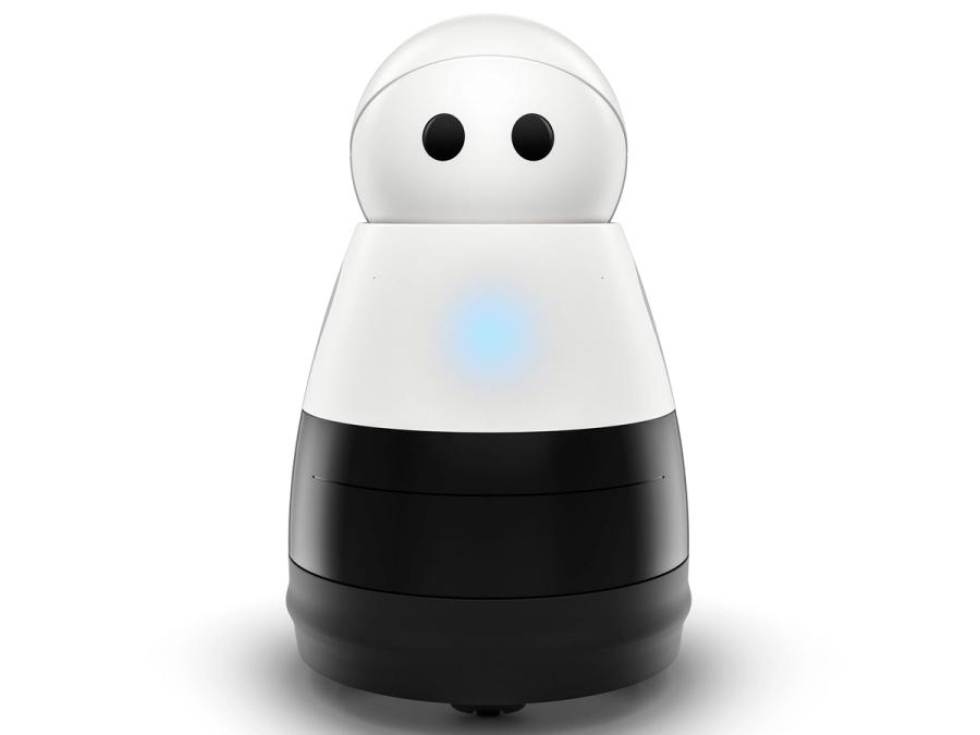 A simple mobile robot with a black wheeled bottom, white middle, and white head with two black circles for eyes. A blue light glows on its chest.