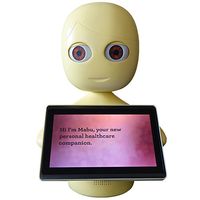 A simple yellow robot with a tabletop base supporting an egg shaped head which has big brown eyes. It holds a tablet which has text on it.