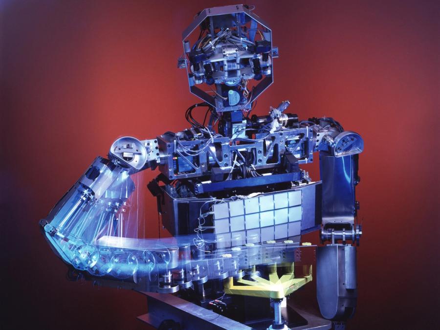 Multiple exposure photograph of the robot turning a hand crank.