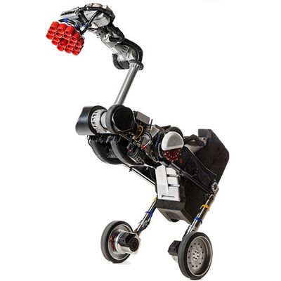 A two-wheeled balancing robot with a tall body including a jointed extendable arm with a pattern of red suction cups on the end.