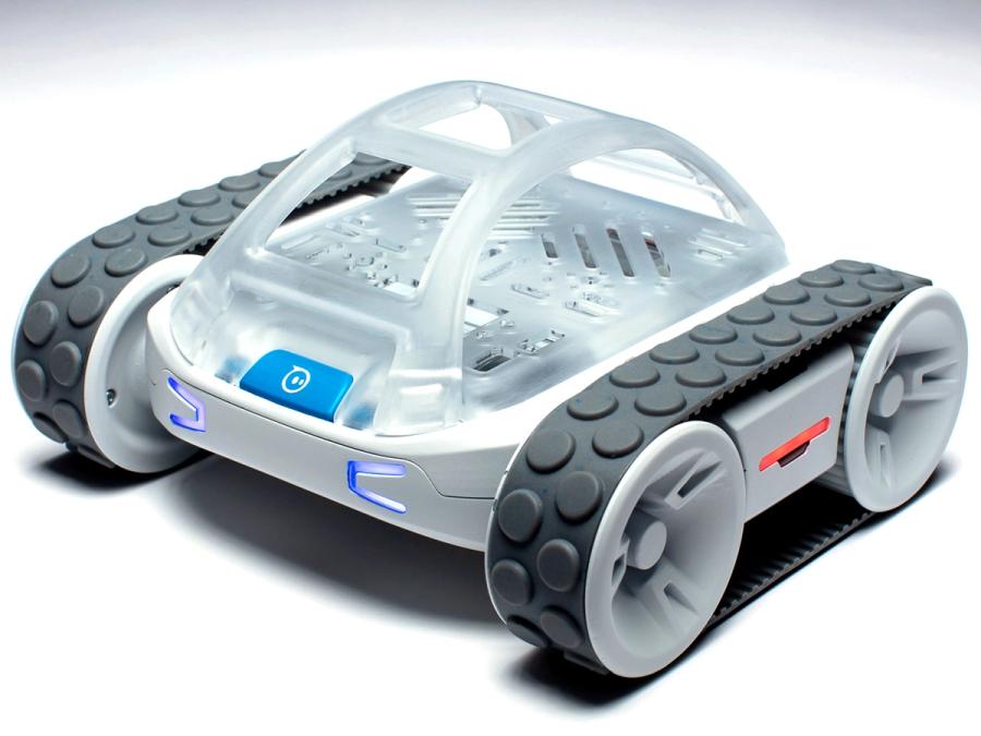 A small mobile vehicle with a base, four wheels, and a translucent chassis. Each set of two wheels shares a tracked cover.