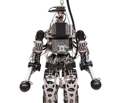 Close-up spinning view of the electronics-filled humanoid robot.