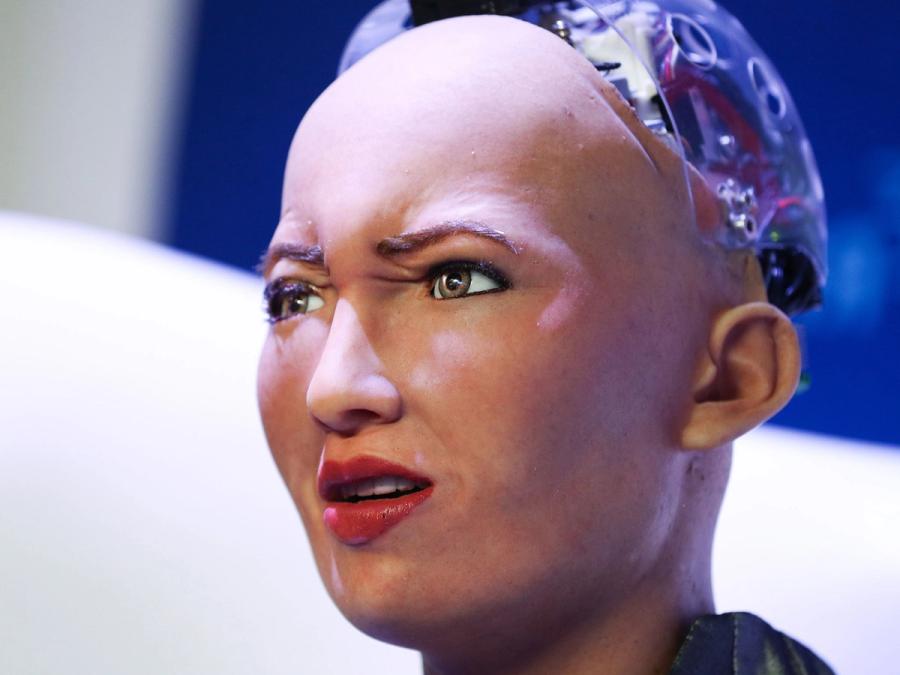 Close-up of the Sophia robot's face making a pained expression shows the skin used on her face.