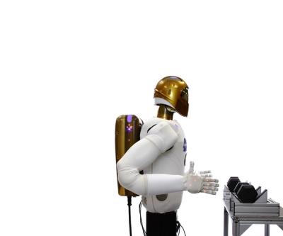 A robot astronaut torso on a base, with a gold helmeted head, and white body and arms picks a weight up from a rack, does some bicep exercises, and then returns it.
