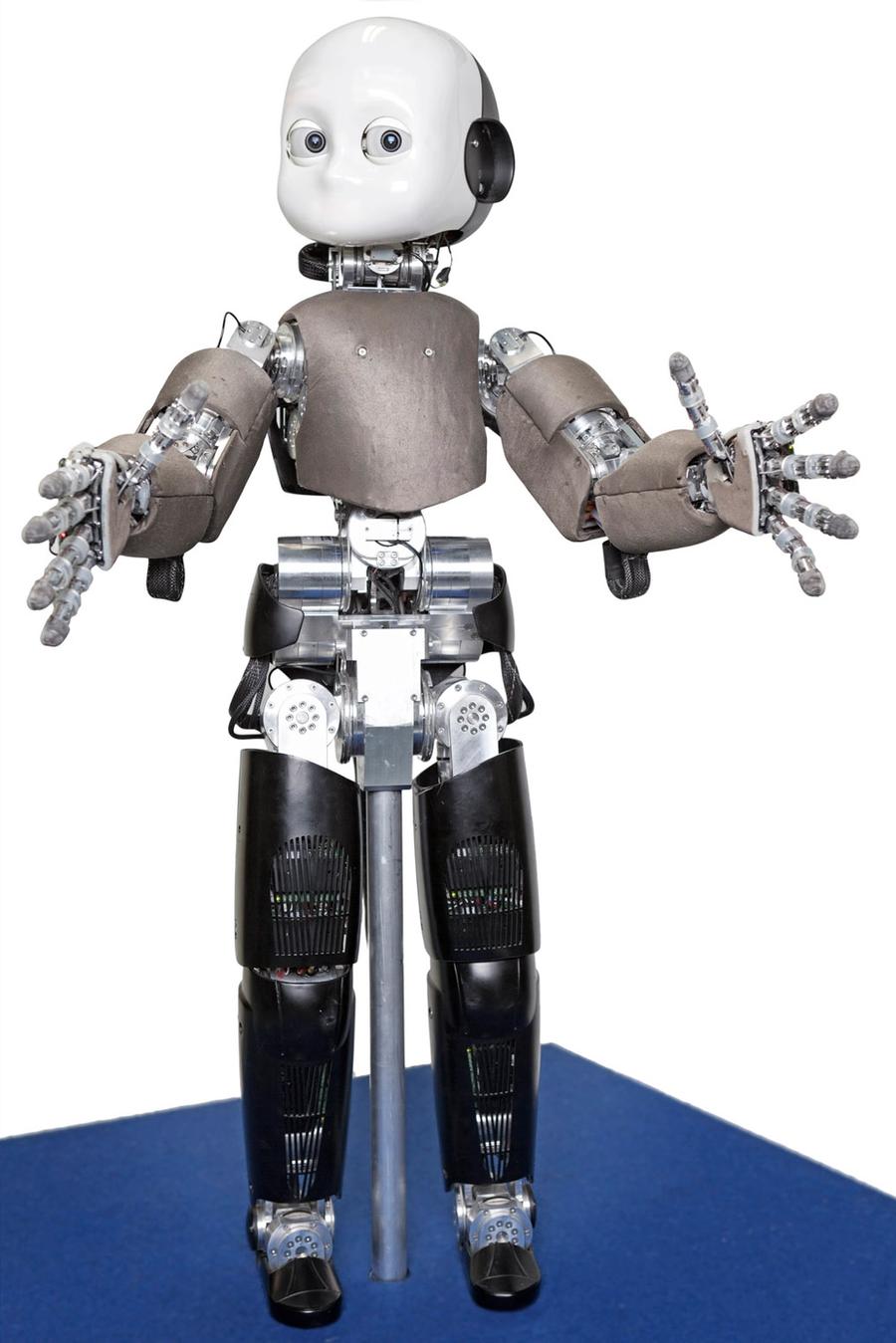 A child-like humanoid robot holds its jointed hands out towards the camera.