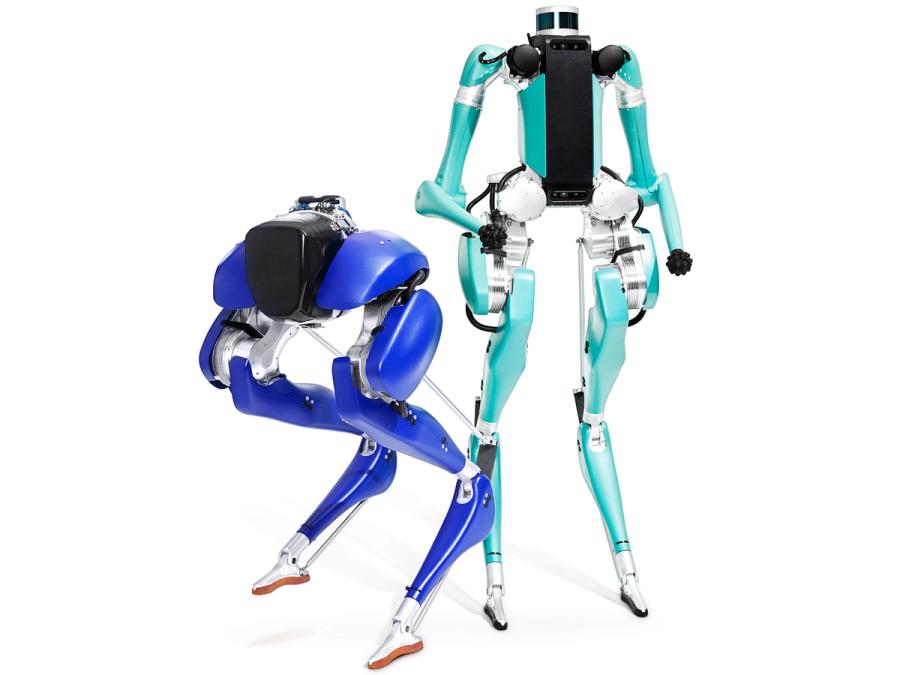 Cassie, a legged robot and Digit, a bipedal humanoid robot that share similar aesthetic appearance are posed together.