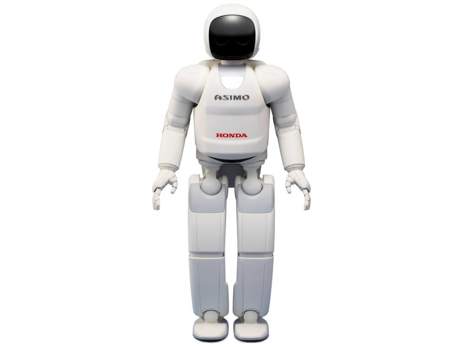 A human shaped robot that is white with a dark faceplate like an astronaut. It is labelled Asimo and Honda.