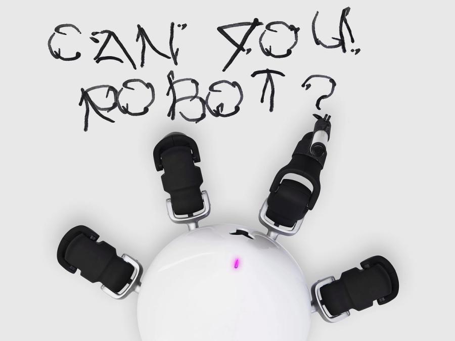 One of HEXA's four visible legs holds a marker, and it has written "Can you robot?".