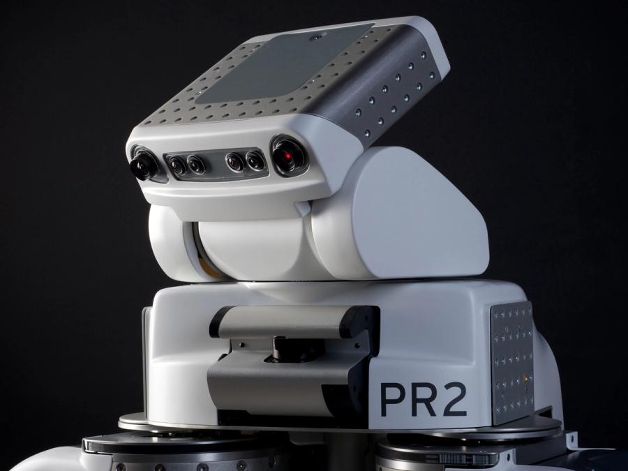 Close-up of the robots head showing off it's tech. It is labelled PR2.