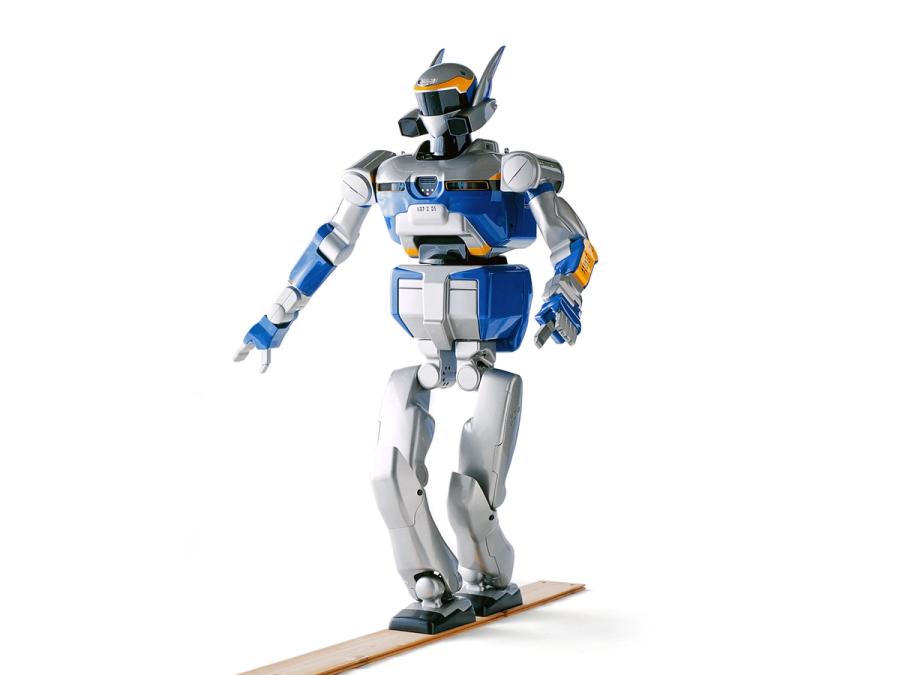 The humanoid robot balances with one foot in front of the other on a thin wooden plant.