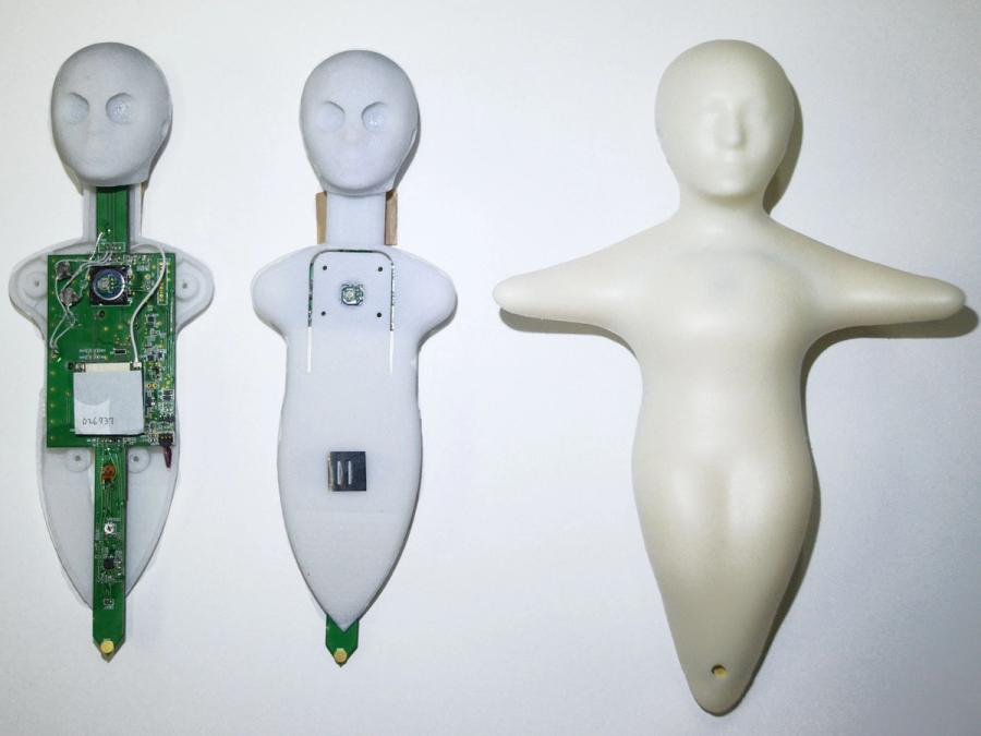 Three views of Elfoid show its skin, plastic shell and circuitboard insides.