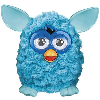 A blue furry toy that resembles an owl, with large eyes, a yellow beak and pointy ears.