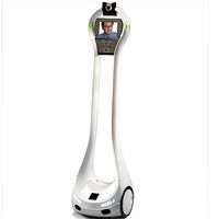A lightweight white telepresence robot with a thin hollow frame and a display showing a persons face.