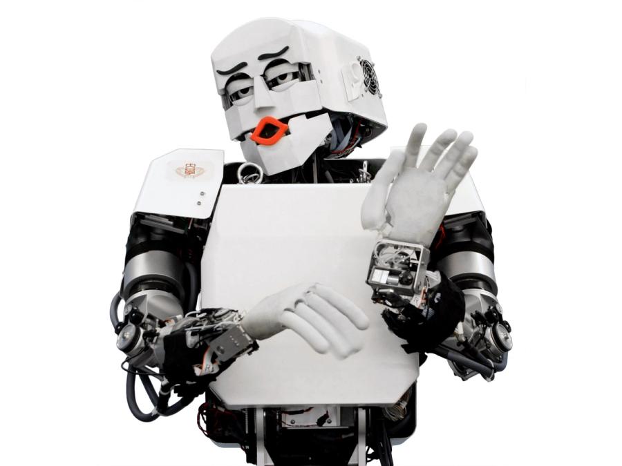 An expressive humanoid robot makes a gesture with it's hands as it appears to roll its eyes and purse is lips.