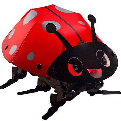A small ladybug shaped robot composed of sheets folded together and held by rivets. It has 6 bent flipper legs.