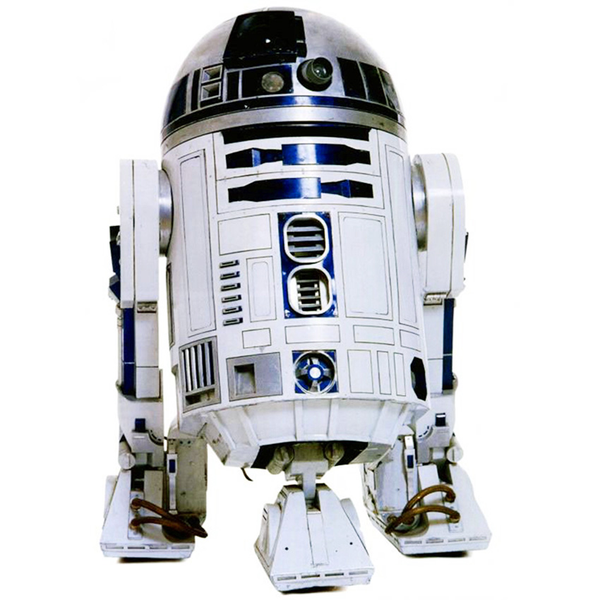R2-D2 droid from Star Wars, with a trashcan sized white and blue body, round top with cameras and sensors, three short wheeled legs, set against a white background.