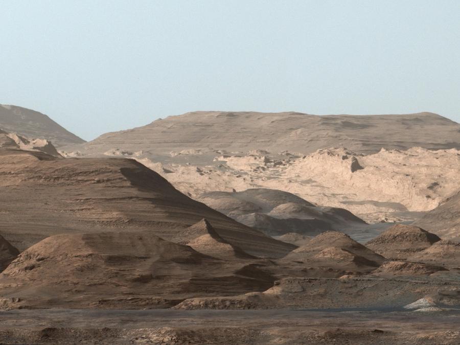 A rusty colored Martian landscape.