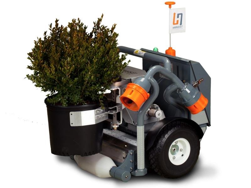 A short wheeled robot with a roller on it's bottom balances a potted plant on top of the roller and in between its front claw.