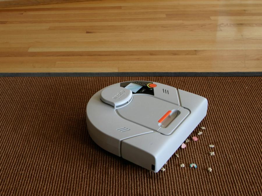 A robot vacuums up cereal.