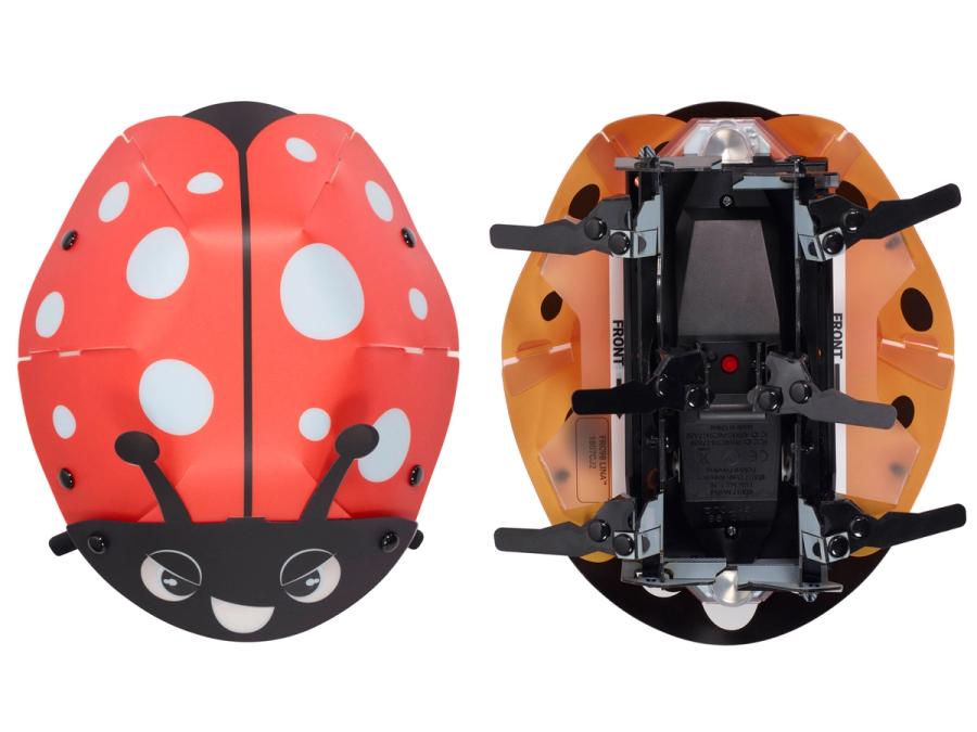 Top and bottom views of a small ladybug shaped robot composed of sheets folded together and held by rivets. It has 6 bent flipper legs.