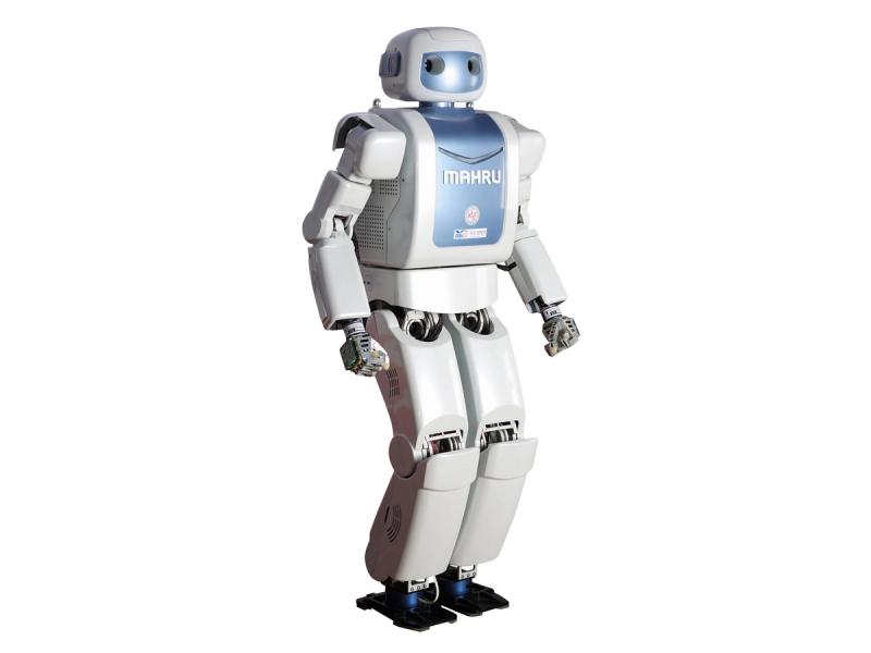 A standing white bipedal robot with a blue faceplate and torso, labelled MAHRU. 