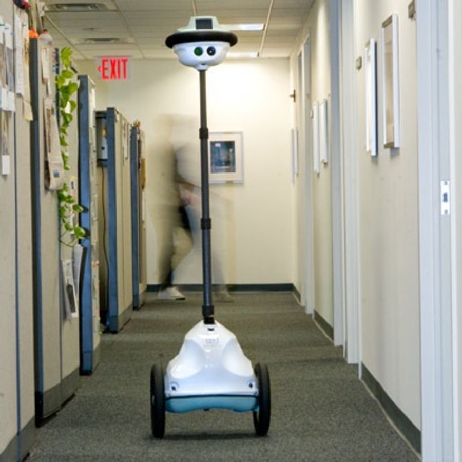 A telepresence robot in an office.