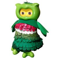 A 30 cm cartoonish robot with a green shell and feather like outfit that gives it the appearance of an owl with a smiling yellow face.