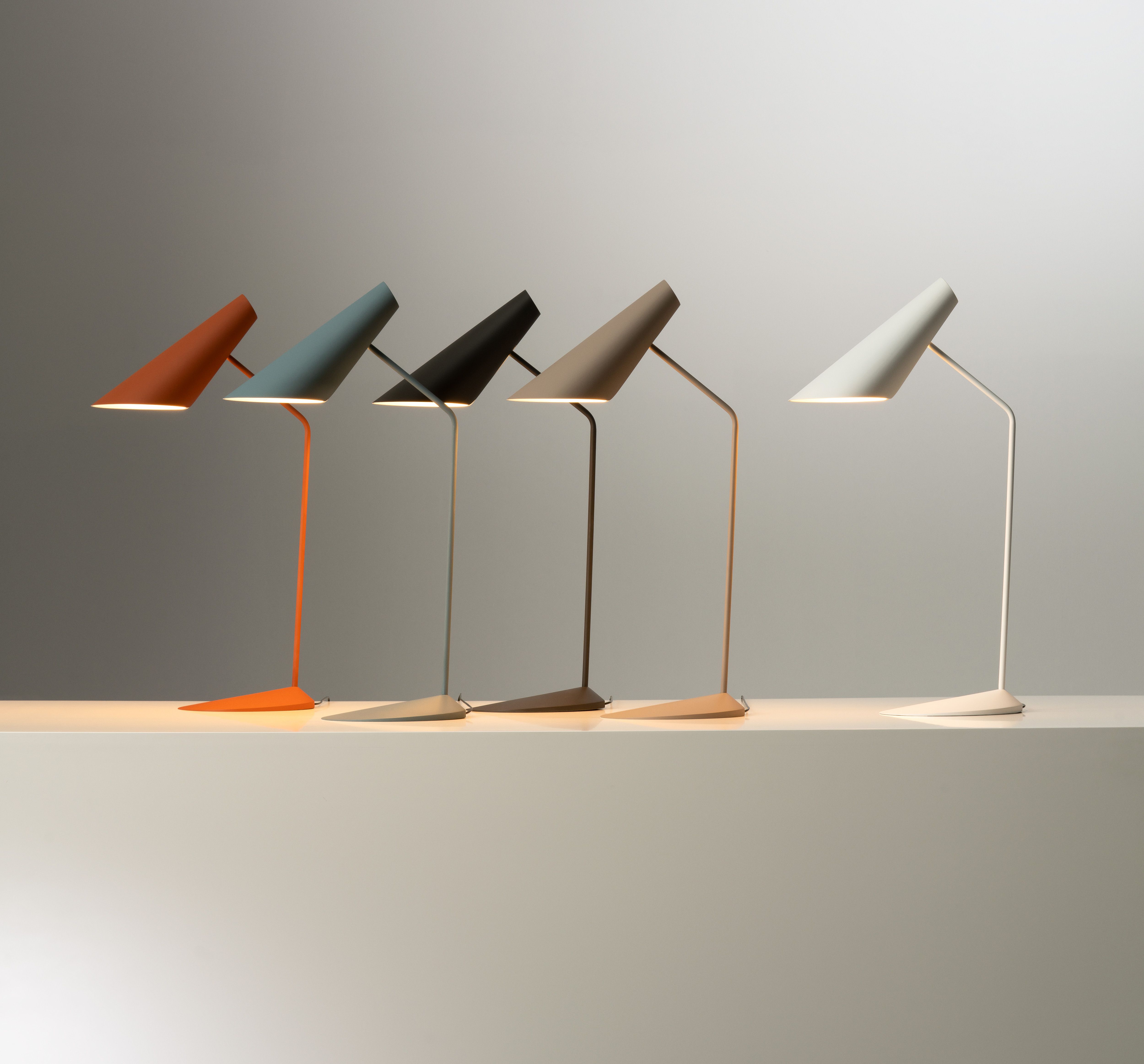 The Vibia I.Cono floor and table lamp, designed by Lievore Altherr Molina, features smooth surfaces and a refined silhouette that hide advanced mechanisms for rotating the shade, providing precise lighting ideal for reading, available exclusively through Above 90 Lighting.