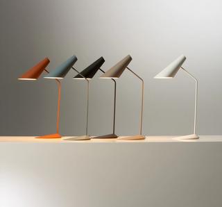 The Vibia I.Cono floor and table lamp, designed by Lievore Altherr Molina, features smooth surfaces and a refined silhouette that hide advanced mechanisms for rotating the shade, providing precise lighting ideal for reading, available exclusively through Above 90 Lighting.