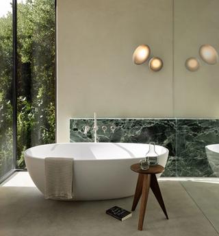 The Pebble Series, offered in Ceiling/Wall, Pendant, Chandelier, and Table variations, combines organic shapes with diffused lighting for a soft ambiance.