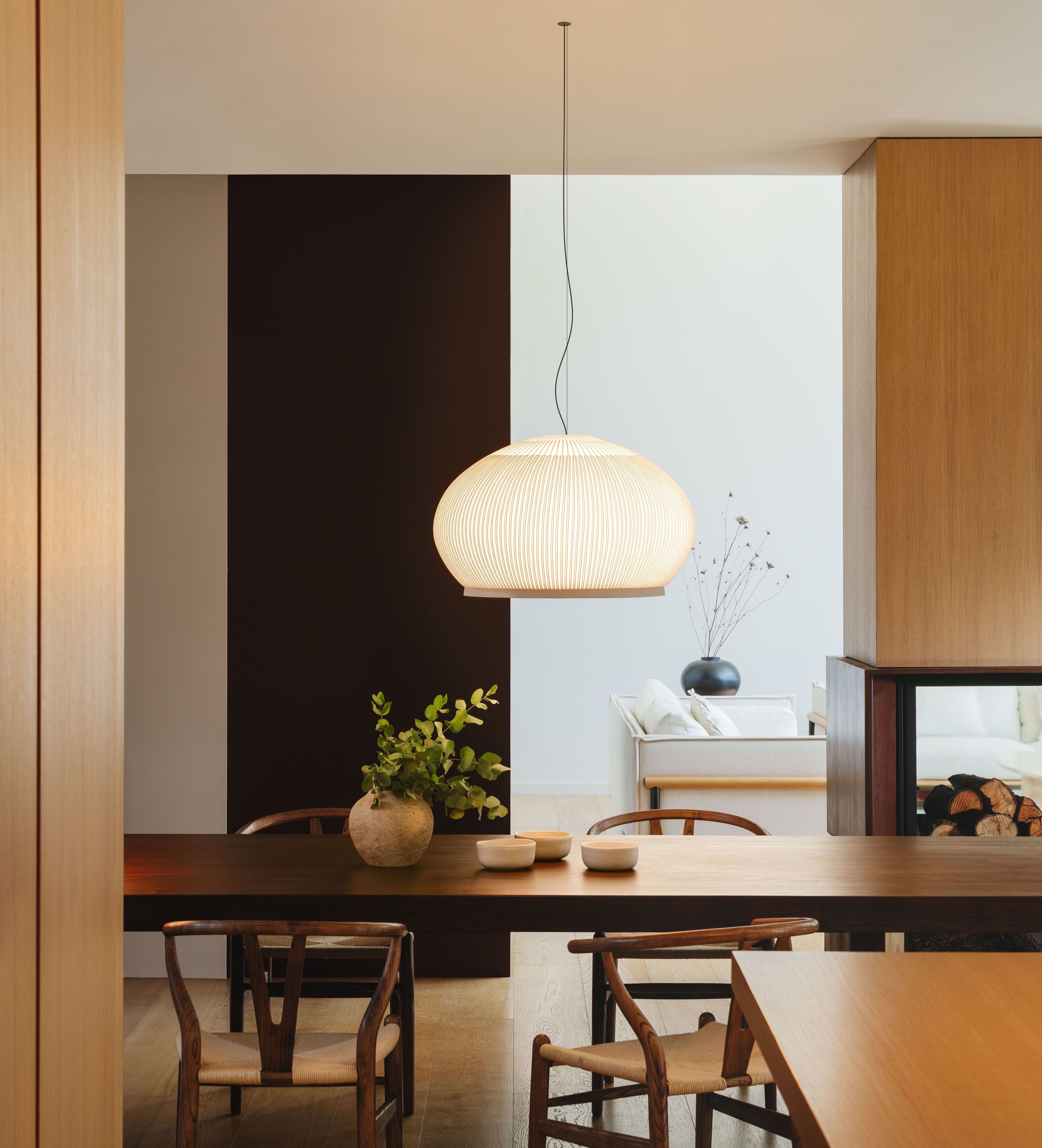 The Vibia Knit pendant collection, available exclusively through Above 90 Lighting, reimagines traditional lampshades with a contemporary fabric cover that creates an intimate glow.