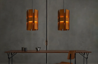 Vector Series Pendant by Lukas Peet. Brutalist-inspired design with weathered steel, black steel, or polished stainless steel. Bidirectional lighting with a gradient effect.