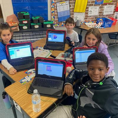 Students coding with their chromebooks.
