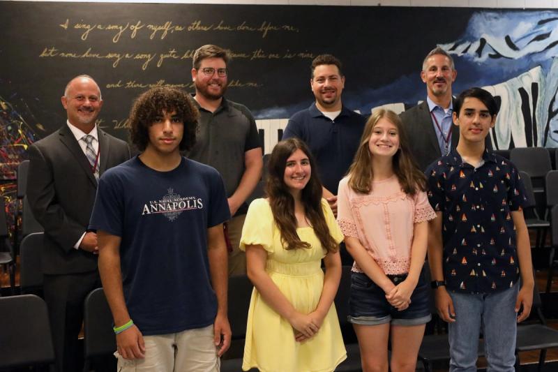 Principal of WWHS, Ken Costa, and Assistant Principal, Jon Varlamos, join Band Director, Matthew Hoffman, and Choir teacher, Steve Altinel, in congratulating their musicians.