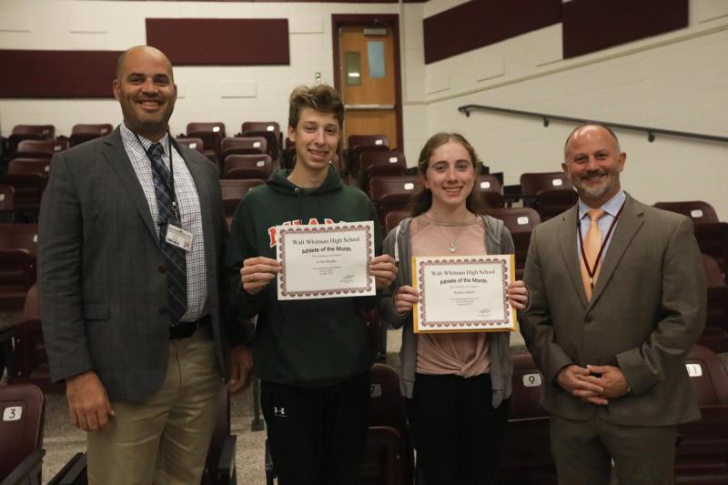 Supervisor of Athletics, Dave Barth, and Principal, Ken Costa, presenting Colin and Kate as October's Athletes of the Month.