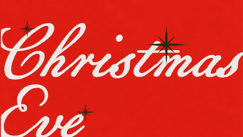 Christmas Eve title slide: white script lettering with black stars on a bright red background