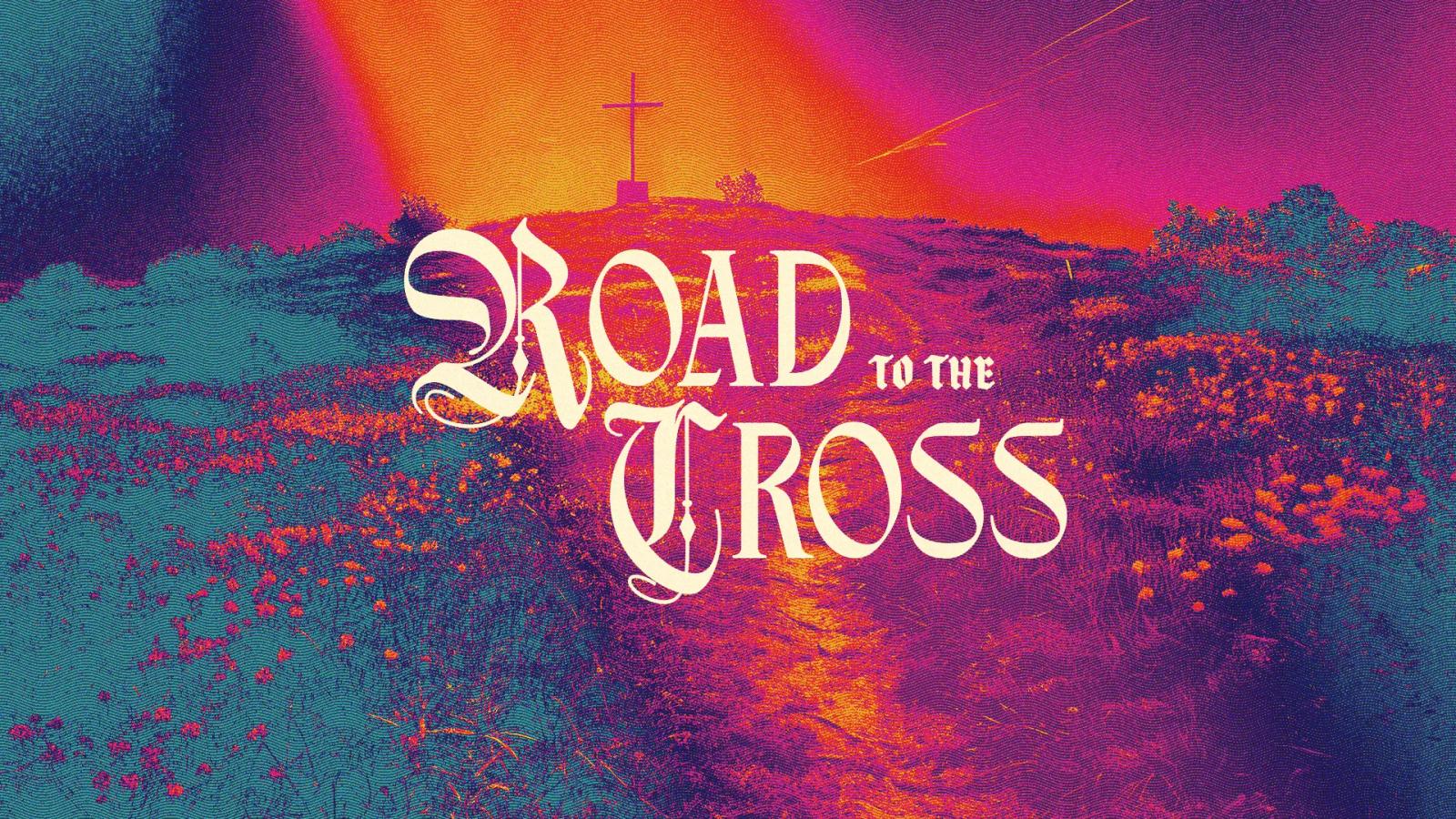 Road to the Cross title slide: white blackletter lettering over a hillside of red flowers glowing purple and orange, with three crosses on the hill