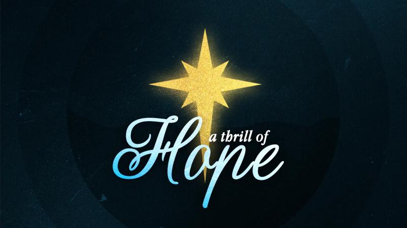 A Thrill of Hope title slide: a glowing gold star above blue script lettering on a dark background